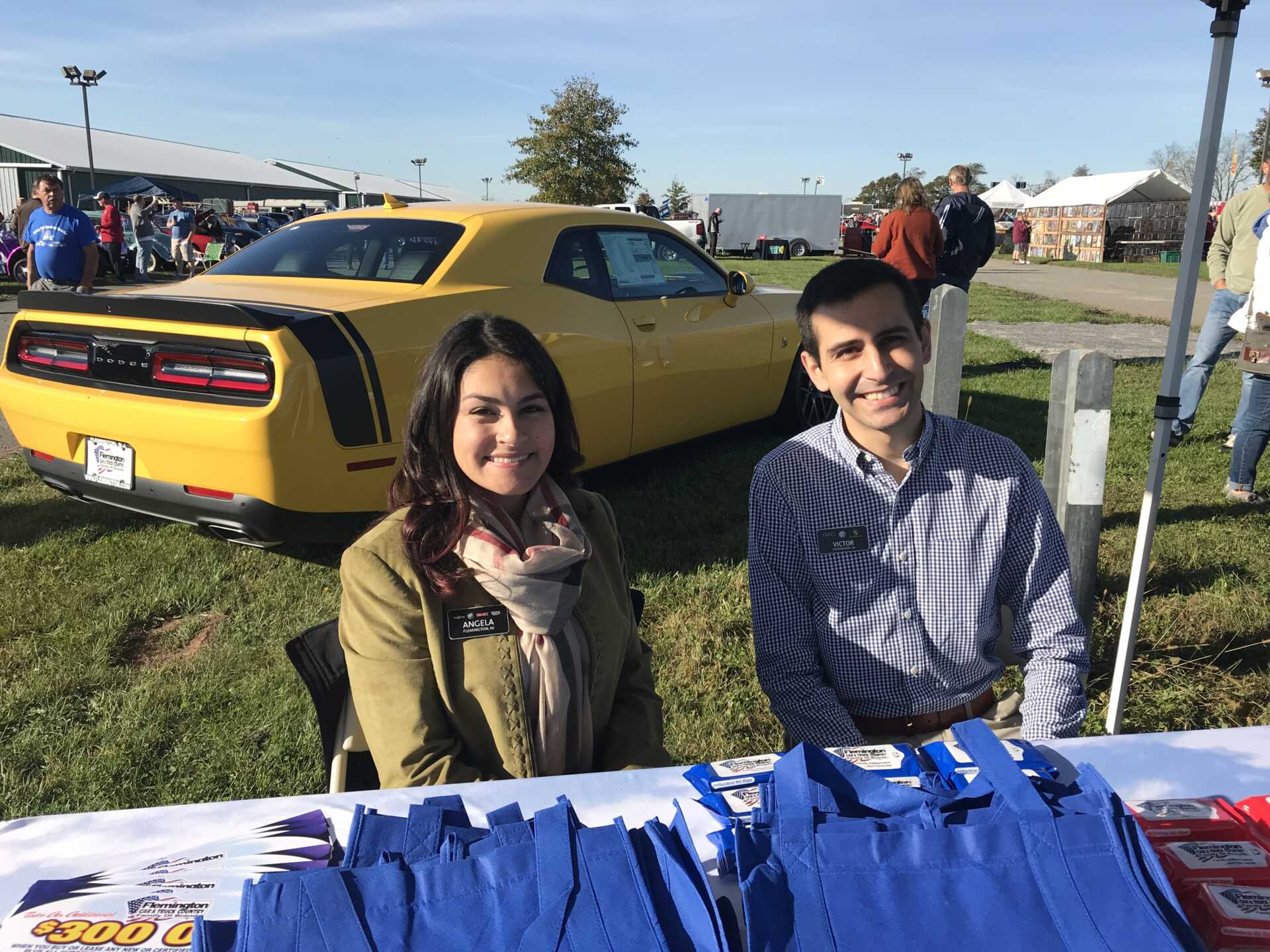 Angela Karas and Victor Belisle with Yellow Dodge Challenger